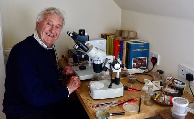 Richard Fortey at a microscope